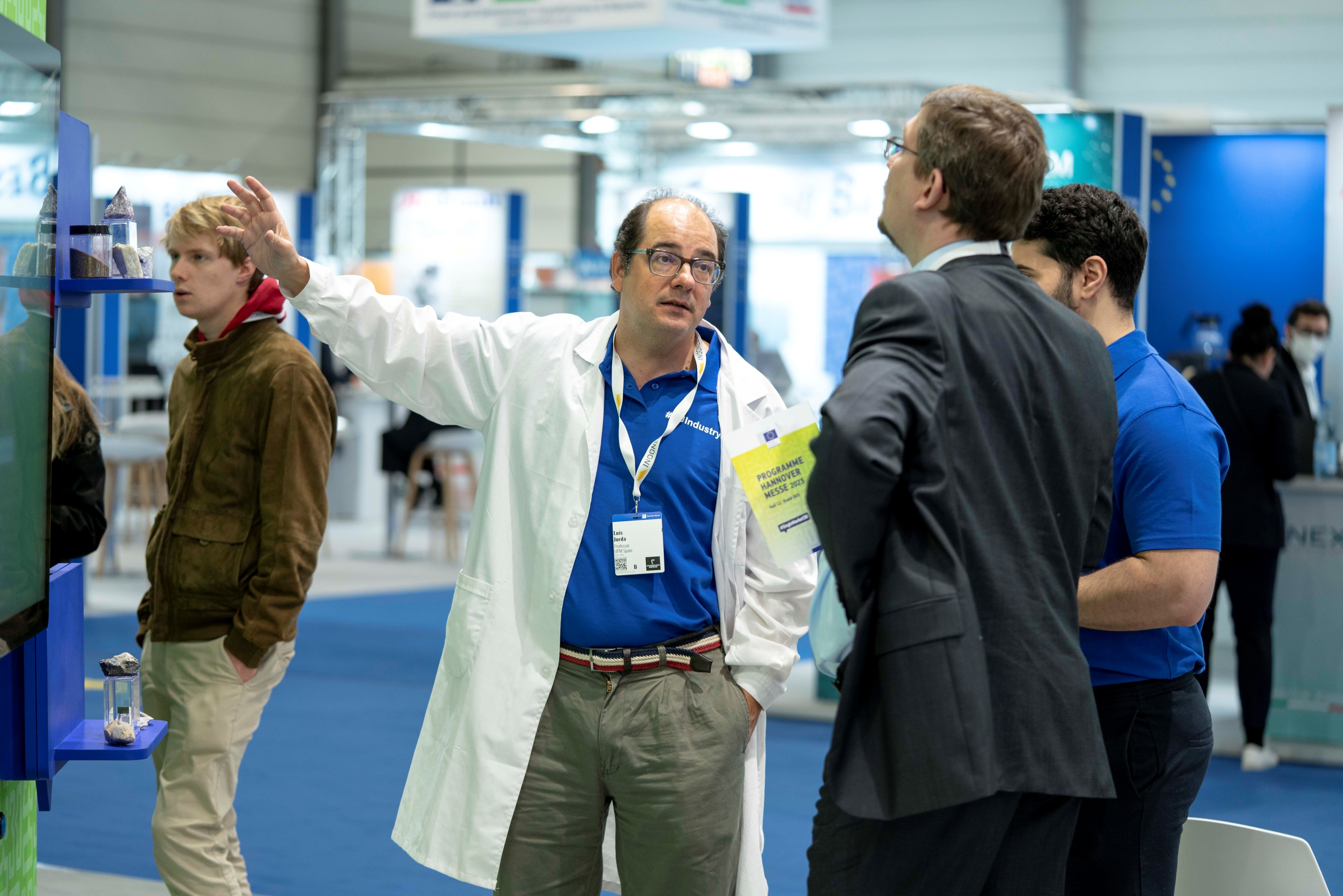 A scientist explaining something to the visitors