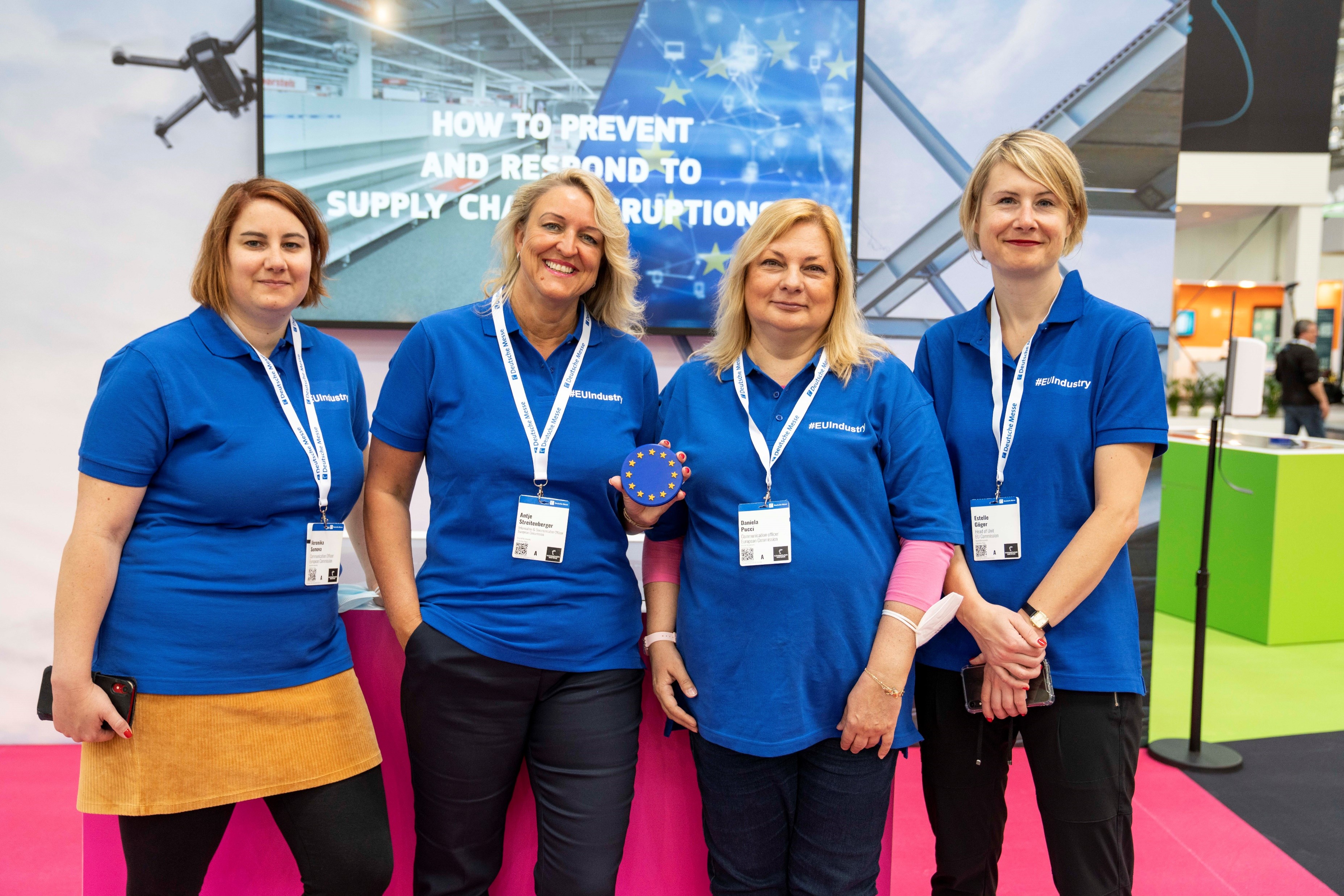 Group photo of the four-women team managing the stand