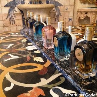 Picture of Parfums Godet perfumes in a row on a counter top