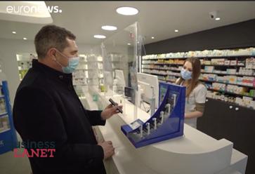 man at pharmacy with mobile phone