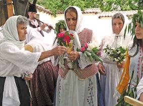 Women in traditional dress with flowers