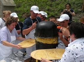 People cooking a typical dish