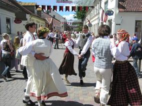 People in traditional dress dancing