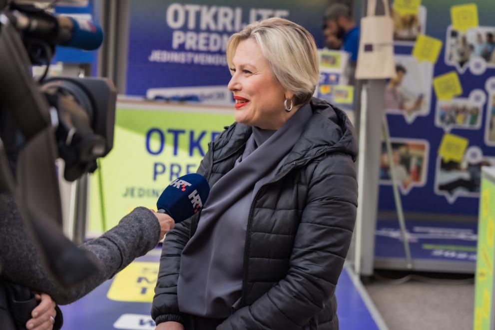 Woman being interviewed by a television