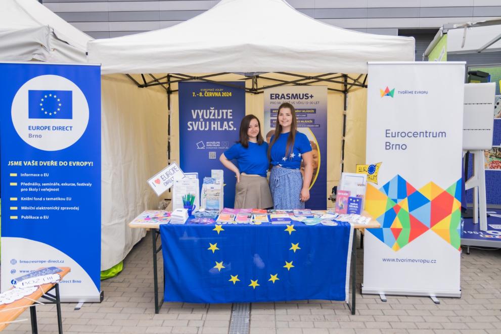 Two women posing at the EU-related stand