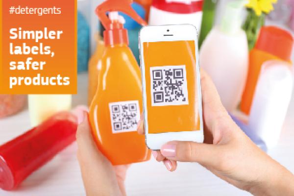 A bottle of detergent with a QR code label being scanned by a phone. The caption reads: Simpler labels, safer products